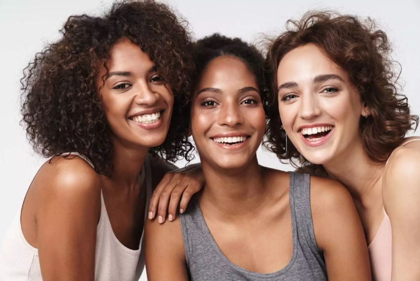 Three woman smiling
